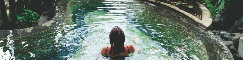 Woman soaking in hot springs